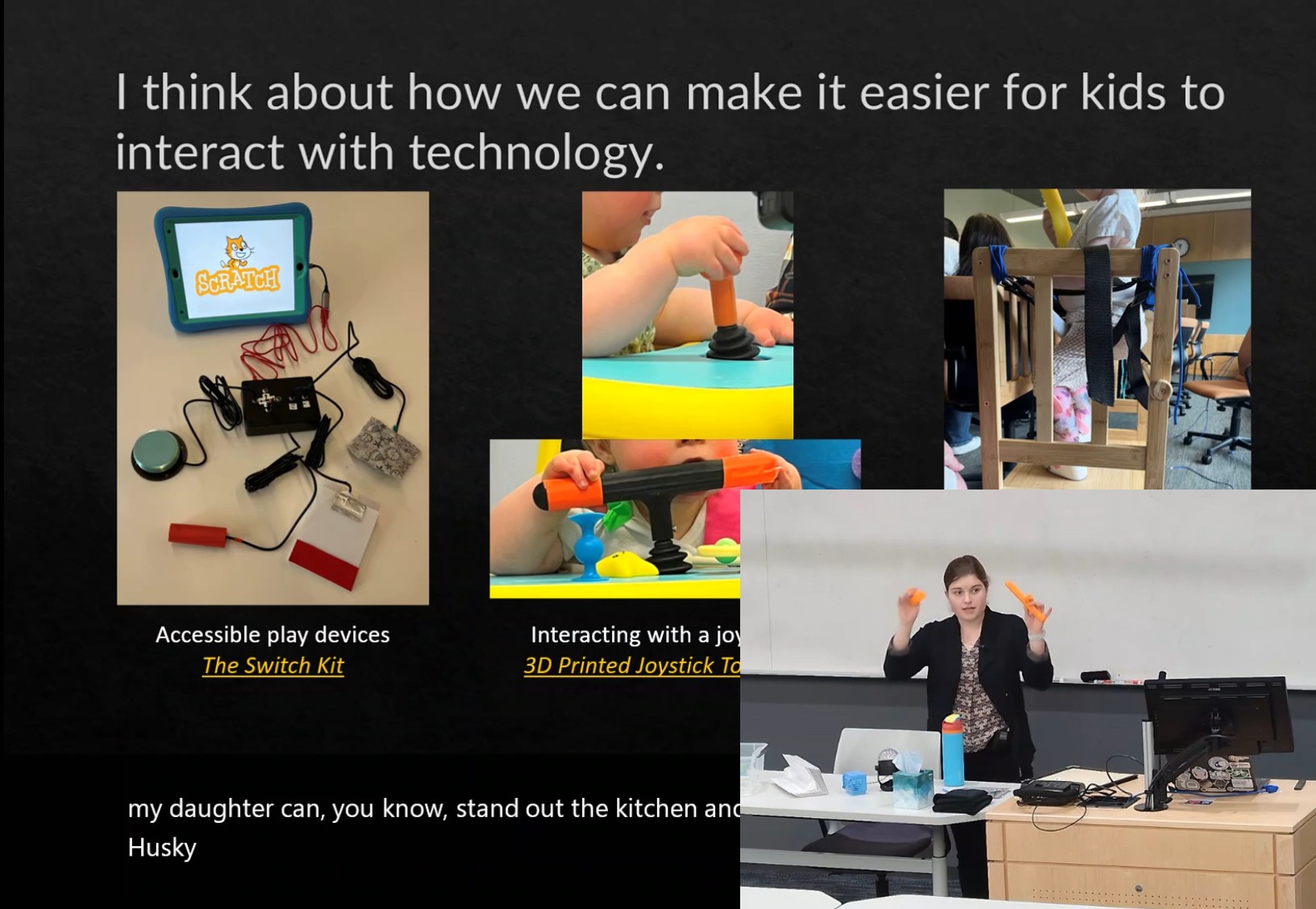 Mia holding up 3D printed accessibility modifications during a lecture on unviersal design.