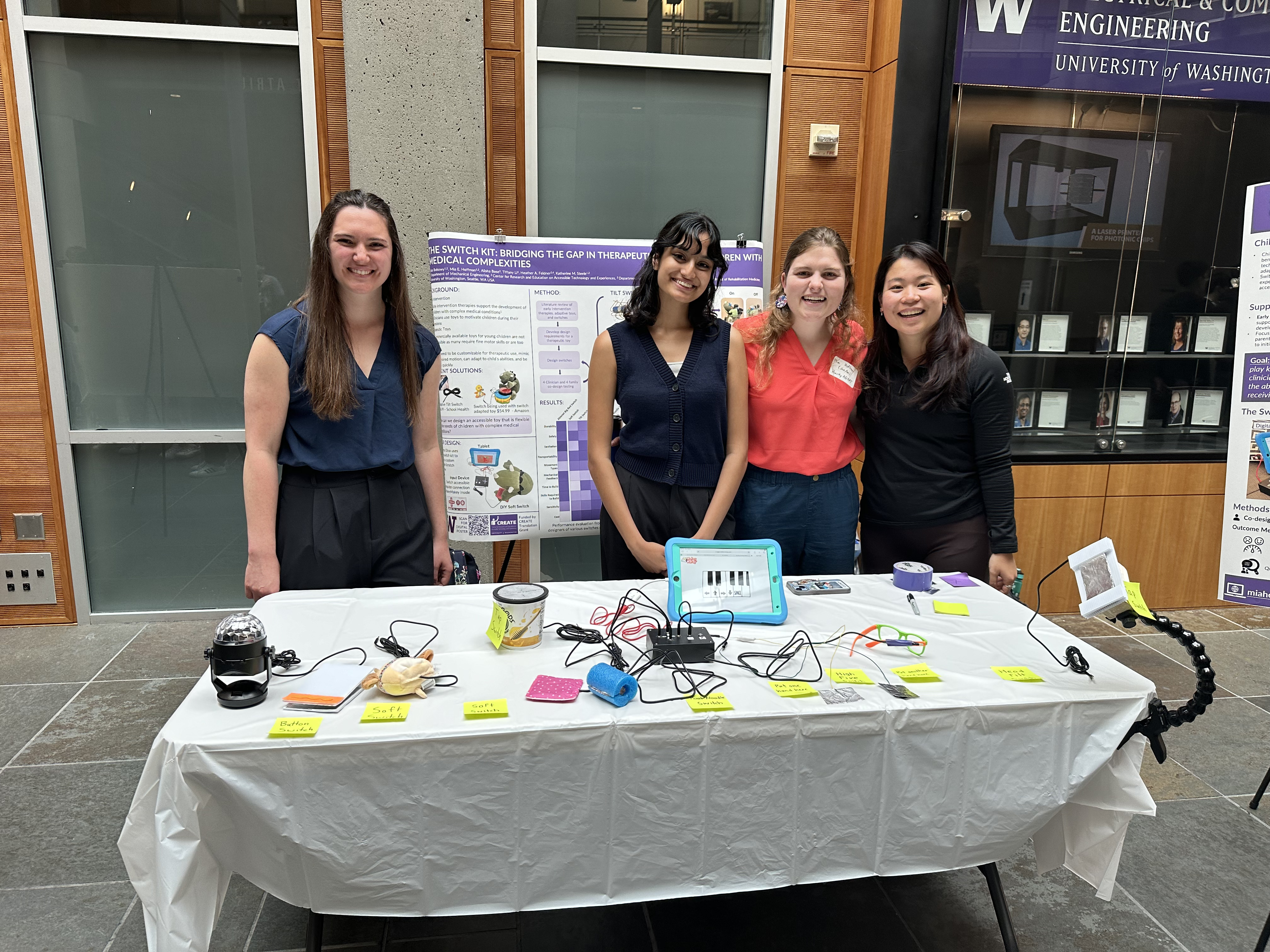 Mia standing with Alisha, Kate, and Tiffany as they present the Switch Kit at the CREATE Research Showcase.